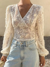 Ivory lace sheer long sleeve wrap blouse with delicate floral embroidery and sheer long sleeves for elegant wear