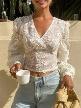 White lace sheer long sleeve wrap blouse with intricate floral embroidery and puffy long sleeves crop top