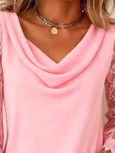 A soft pink lace sleeve cowl neck blouse featuring delicate lace sleeves and a stylish cowl neck design