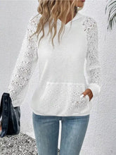 White lace-trimmed kangaroo pocket hoodie with long sleeves made of slightly stretchy fabric and machine wash care instructions