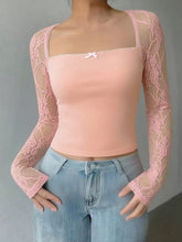 Pink lace long sleeve top with square neck and delicate white bow detail for elegant wear