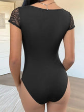 Black lace sweetheart cap sleeve bodysuit with lace trim and short sleeves for a flattering fit
