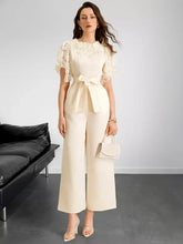 Cream-colored lace trim belted wide leg jumpsuit with machine wash fabric