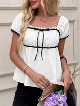 White short sleeve blouse with black lace trim and bowknot tie details elegant and stylish design