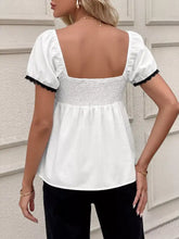 White blouse with puffed short sleeves black lace trim square neckline and smocked waistband lace trim bowknot short sleeve blouse