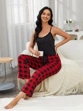 Red and black plaid pajama pants with a drawstring waist from lace trim cami and plaid pants lounge set