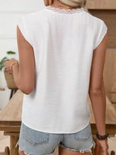 White sleeveless lace trim notched blouse featuring delicate lace trim at the neckline for elegant wear