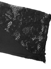 Black lace trim with delicate floral patterns overlays smooth fabric on a one shoulder black lace trim bodysuit