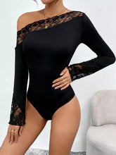 Black one-piece shoulder bodysuit with lace trim detailing on shoulders and cuffs in long sleeve design
