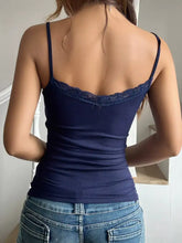 Navy blue lace trim ribbed cami top with spaghetti straps and delicate lace trim at the neckline