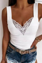 White lace-trimmed tank top with scalloped edges and thin straps in multiple sizes