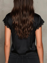 Black satin blouse with lace trim tie on short sleeves featuring delicate lace trim tie-front design