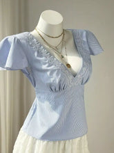 Light blue and white striped lace trim v-neck blouse with delicate lace on the neckline and short puffed sleeves