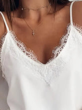 White lace trim v neck cami spaghetti strap top featuring delicate lace trim and lightweight fabric for layering