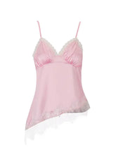 A delicate pink lace trimmed satin camisole featuring lace trim along the neckline and hem