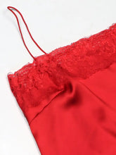 Red satin lace trimmed satin camisole with delicate floral lace trim and thin spaghetti straps for elegant wear