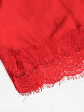 Red lace trimmed satin cami featuring delicate floral lace trim along the edge of luxurious satin fabric