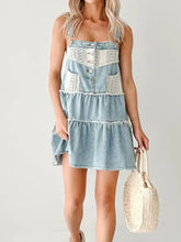 Light blue denim mini dress with tiered layers white lace trim and button details lace-trimmed tiered denim mini dress
