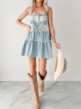 Light blue denim mini dress with white lace trim and button details featuring a tiered design denim mini dress