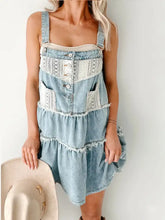 Lace-trimmed tiered light-wash denim mini dress with white lace trim and button details in a denim mini dress style