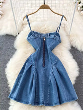 A fitted medium-wash denim dress with a corset-style back zipper and frayed hem in a lace-up a-line mini dress design