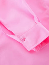 A crisp pink lace-up front oversized shirt cuff with matching button and neatly stitched seams
