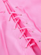 Pink satin corset with matching laces and silver-toned eyelets paired with lace-up front oversized shirt