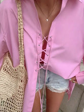 Soft pink oversized shirt with lace-up front long sleeves and relaxed fit in subtle sheen lace fabric