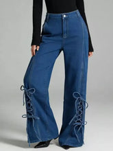 Blue denim lace-up wide leg jeans featuring side detailing for a stylish and comfortable fit