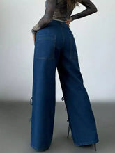 Dark blue wide leg jeans made of denim featuring lace-up side ties for a stylish wide leg fit