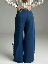 Deep blue wide leg jeans with front pockets and side tie details made of denim for stylish casual wear