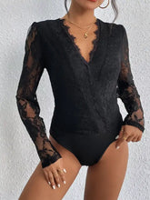 Black lace v neck long sleeve bodysuit with sheer mesh detailing and a flattering v neckline for elegant wear