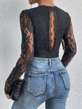Black lace v neck long sleeve bodysuit with floral pattern and back cutout showcasing the back side of the design