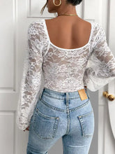 White floral lace v neck long sleeve bodysuit with square neckline and sheer flowing sleeves in delicate lace material