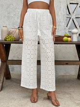 White lace wide leg pants with drawstring waist and floral pattern