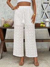 White lace wide leg pants with drawstring waist and floral pattern