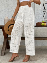White lace wide leg pants with drawstring waist and floral pattern