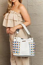 Large shoulder bag with white multicolored checkered pattern and adjustable crossbody strap