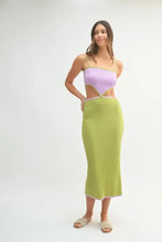 Woman in lavender green ribbed color block cutout midi dress