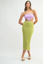 Woman in lavender green ribbed color block cutout midi dress