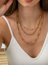 Layered 18k gold-plated chain necklace with interlocking links, beads, textured design