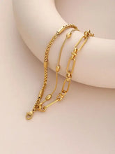 Layered 18k gold-plated chain bracelet with herringbone, beaded, and paperclip links