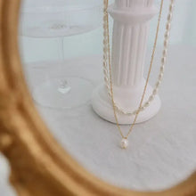 Elegant freshwater pearl necklace with gold chain and baroque drops