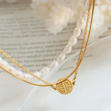 Double-layered titanium steel gold necklace with Fu charm and white pearls