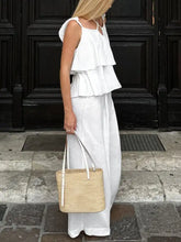 Woven straw tote bag with white leather handles for Layered Ruffled Cami and Pants Set