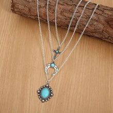 Layered silver necklace with artificial turquoise stone pendants