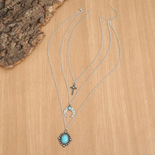 Layered silver necklace with artificial turquoise stone pendants
