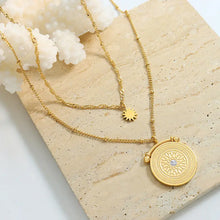 Layered stainless steel gold necklace with sun charm and gemstone pendant