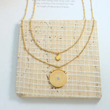 Two layered stainless steel gold necklaces with sun charm and gemstone pendant