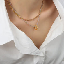 Layered titanium steel necklace with 18k gold-plated chain and oval beaded pendant